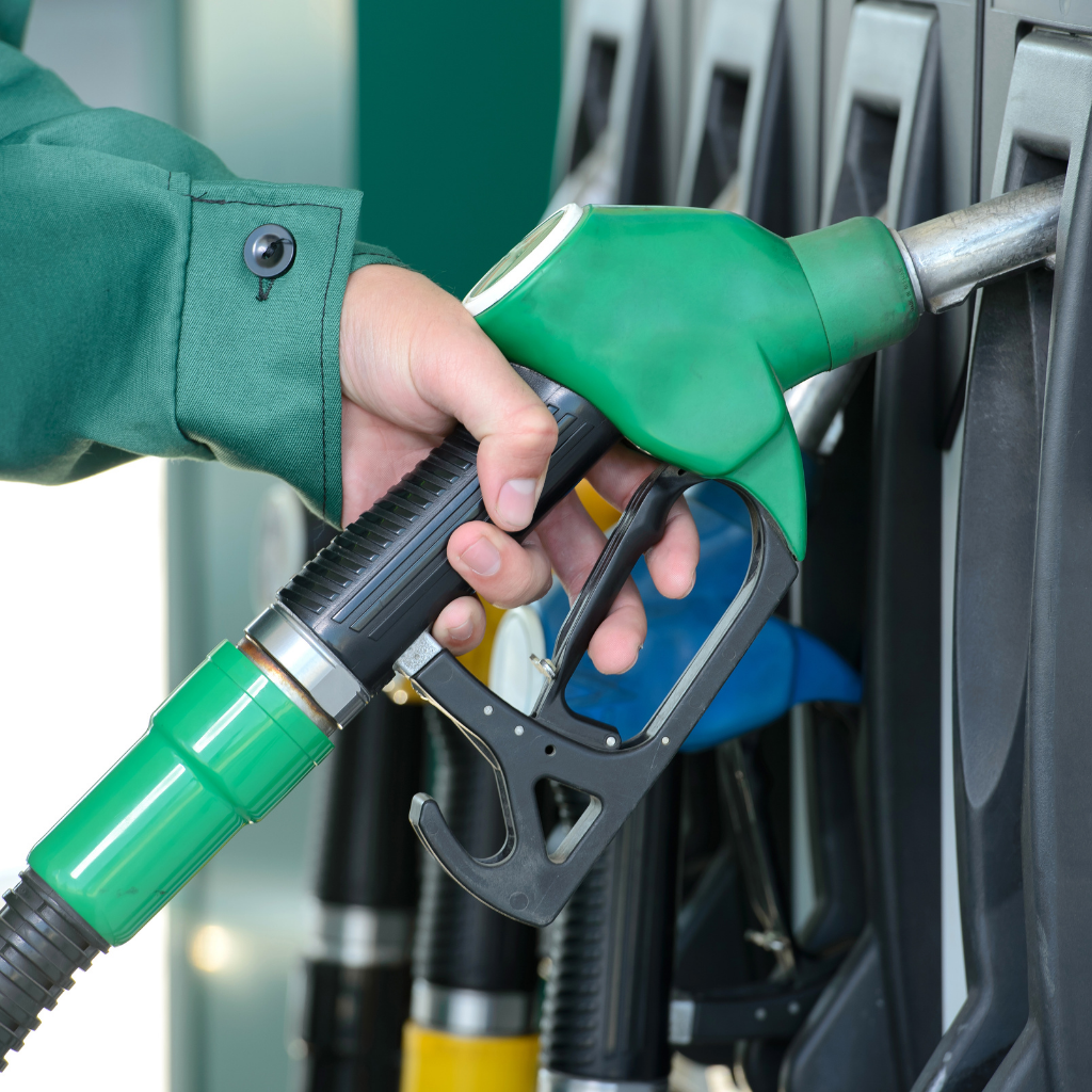 Photo of hand on a fuel pump about to fill up