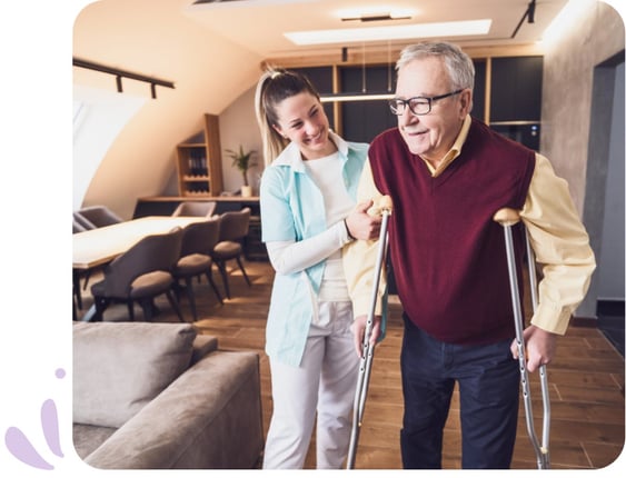 Caregiver assisting individual with crutches during injury recovery
